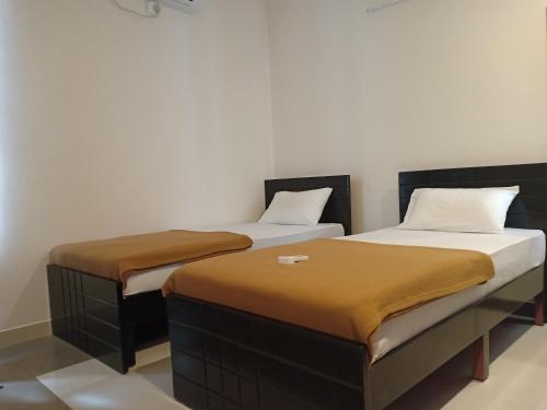 Postel nebo postele na pokoji v ubytování GTS SUITES