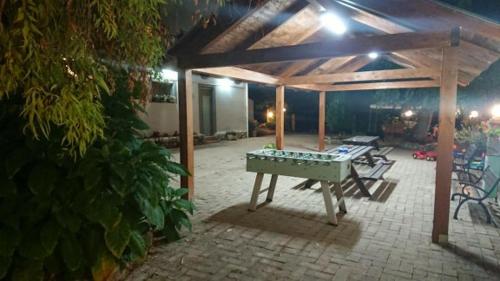 a covered patio with a ping pong table in the middle at La Quiete in Montenero di Bisaccia
