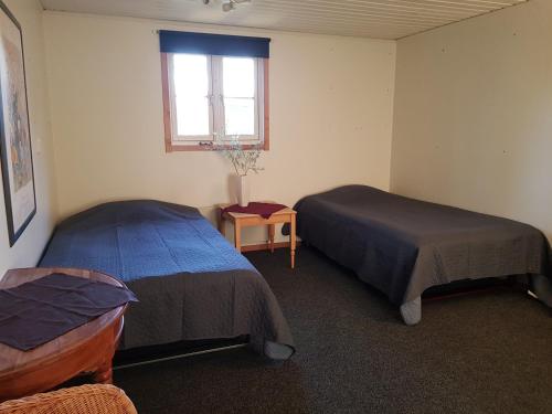 Postel nebo postele na pokoji v ubytování Lilla Huset Oleby