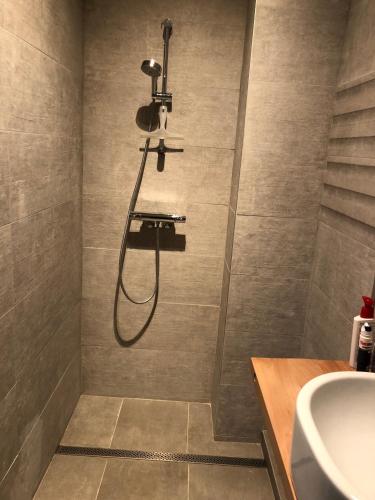 a bathroom with a shower and a sink at Joff in Budingen