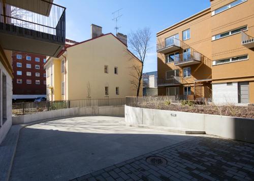 an empty street in a city with buildings at TP City Apartment - City Center in Tallinn