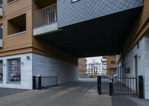 a hallway of a building with a black roof at TP City Apartment - City Center in Tallinn