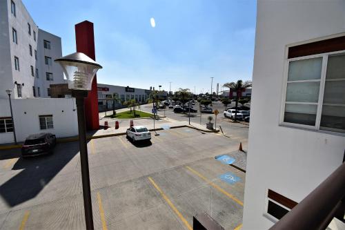 a view of a parking lot with cars parked at Hotel México Inn Express in Salamanca