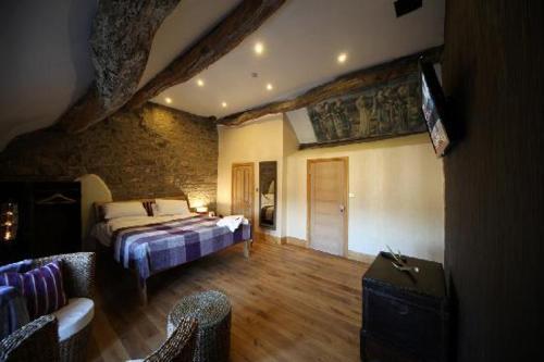 Ένα ή περισσότερα κρεβάτια σε δωμάτιο στο The Rake Tapas Accommodation