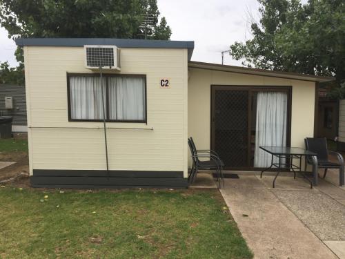 a tiny house with a window and a table at NRMA Yarrawonga Mulwala Holiday Park in Mulwala