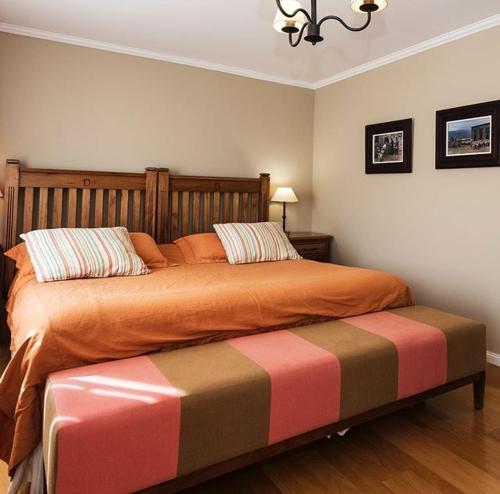 Una cama o camas en una habitación de Lo de Tomy