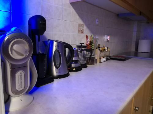 a kitchen counter with several appliances on it at Luxury Home in Spáta