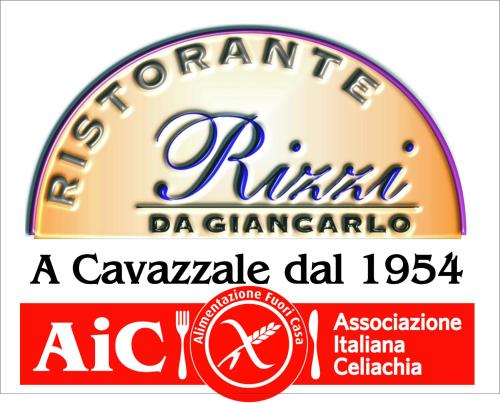 a sign for a car dealer called a carmalarial dat at Hotel Rizzi in Monticello Conte Otto