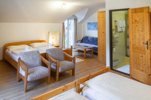 Postel nebo postele na pokoji v ubytování Hotel & Hostel Sandwirt