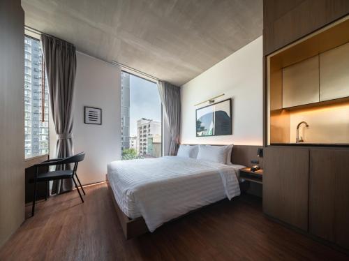 Ένα ή περισσότερα κρεβάτια σε δωμάτιο στο T2 Residence Sathorn