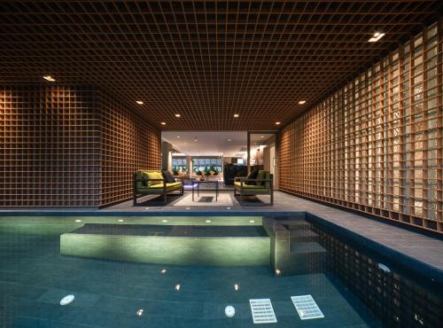 a swimming pool in the middle of a building at T2 Residence Sathorn in Bangkok