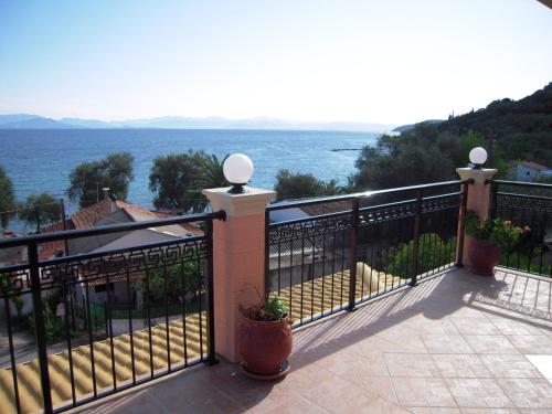 a balcony with a view of the ocean at Villa Pepy in Mesongi