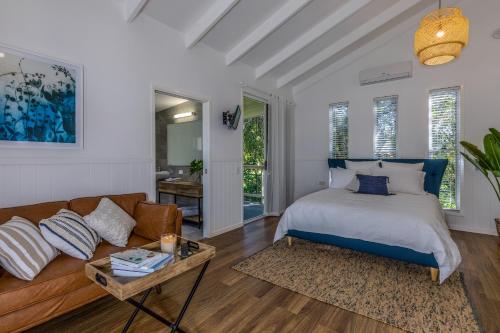 a bedroom with a bed and a couch at Hampton Estate Wines in Mount Tamborine