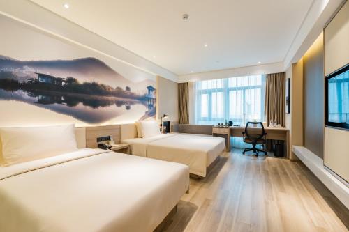 Un ou plusieurs lits dans un hébergement de l'établissement Atour Hotel (Nanjing Xingang Development Area)