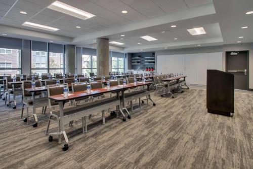 a large conference room with tables and chairs in it at Hyatt Place Iowa City Downtown in Iowa City