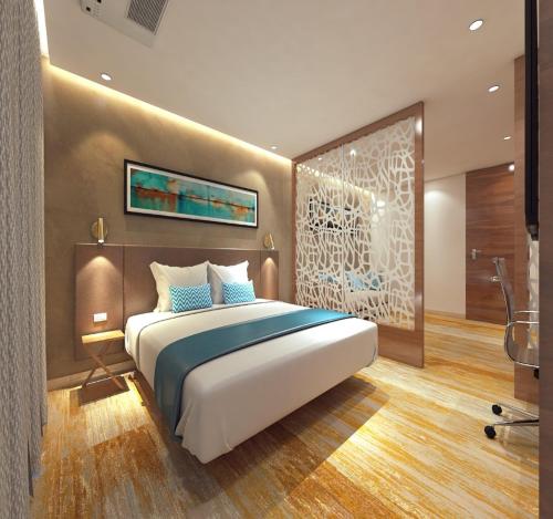 Postel nebo postele na pokoji v ubytování Effotel by Sayaji Vadodara