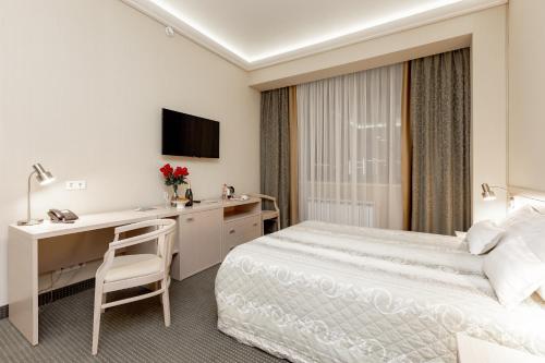 Postel nebo postele na pokoji v ubytování Spa Hotel Meliot
