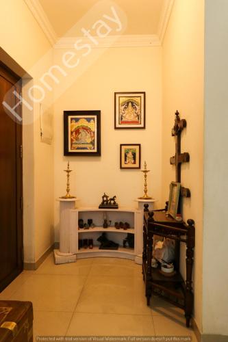 a hallway with a shelf in a room at Homestay for Women in Coimbatore