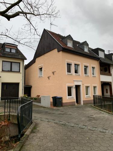 a large house with a driveway in front of it at Ferien Haus am Bach in Föhren