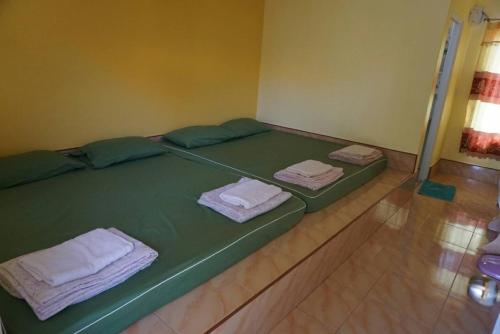מיטה או מיטות בחדר ב-Pooma Resort