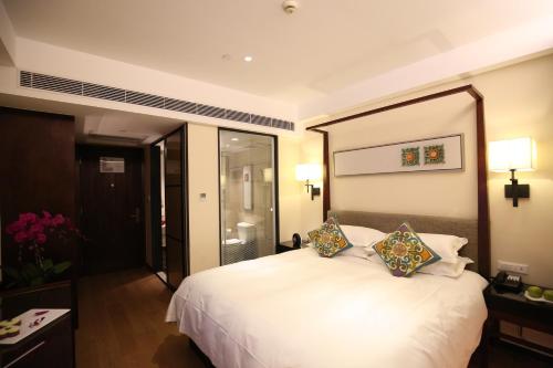 Ένα ή περισσότερα κρεβάτια σε δωμάτιο στο SSAW Boutique Hotel Shanghai Yilin
