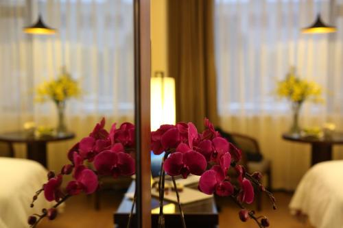 Ένα ή περισσότερα κρεβάτια σε δωμάτιο στο SSAW Boutique Hotel Shanghai Yilin