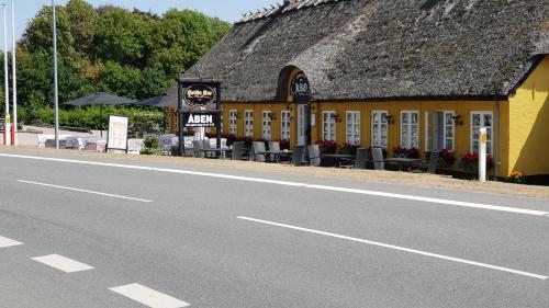 a building on the side of a road at Hodde Kro in Tistrup