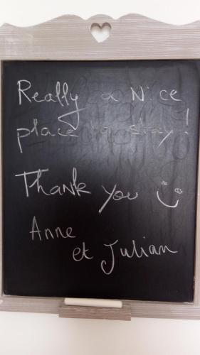 a chalkboard with a heart written on it at Seaview Luxury Penthouse with Shared Swimming Pool in Għajnsielem