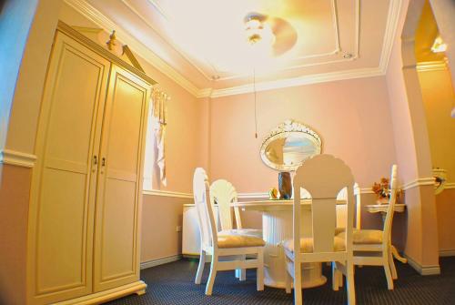 a dining room with a table and chairs at SM Travelodge in Batangas City
