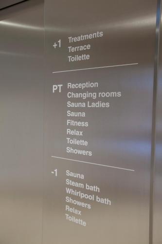 a wall with a bunch of white words on it at Parkhotel Delta, Wellbeing Resort in Ascona