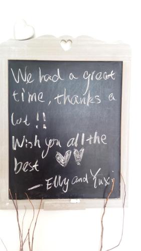 a chalkboard with the words we need a great time me thanks a cut it at Seaview Luxury Penthouse with Shared Swimming Pool in Għajnsielem