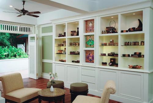 a living room with shelves with shoes on them at Cameron Highlands Resort - Small Luxury Hotels of the World in Cameron Highlands
