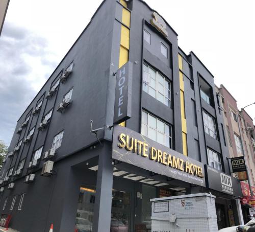 a black building with a sign that reads suite dream house at Suite Dreamz Hotel in Kuala Lumpur