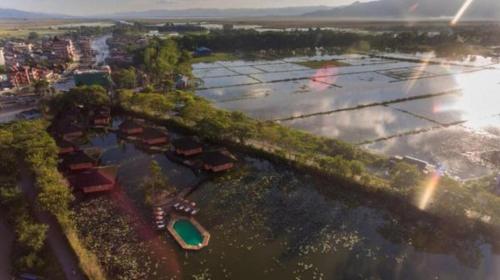 an aerial view of a river with boats in it at ViewPoint Ecolodge in Nyaung Shwe