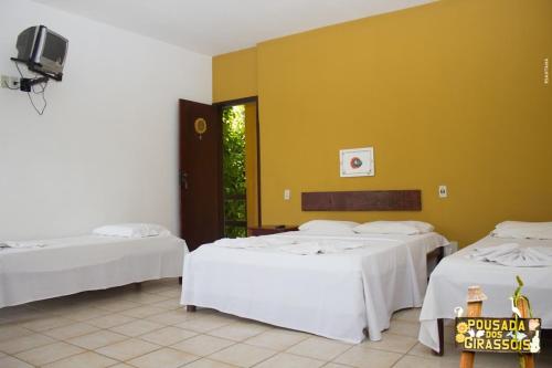 מיטה או מיטות בחדר ב-Pousada Dos Girassois Prado