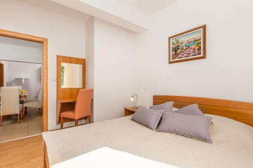 Postel nebo postele na pokoji v ubytování Villas Kampor