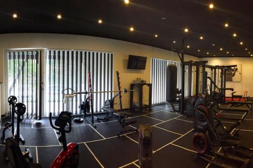 a gym with several exercise bikes in a room at Hotel Roter Kater in Kassel