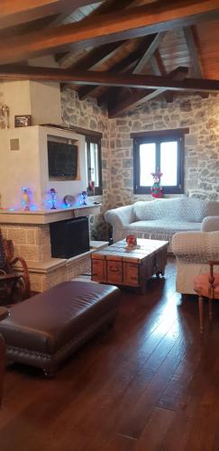 a living room with a couch and a table at Mountain Villa in Graviá