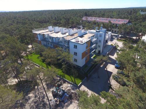 an overhead view of a building in the woods at Apartament Piaskowy NR A5 (3-5 os.) in Rowy