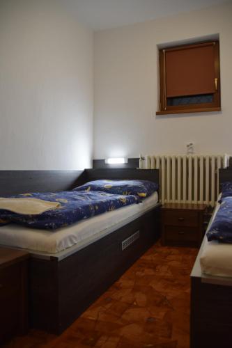 Postel nebo postele na pokoji v ubytování Chata Monika Demänovská Dolina Jasná