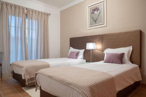Postelja oz. postelje v sobi nastanitve Stunning Caravelas Apartment