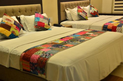 Cama o camas de una habitación en Hotel H R Palace