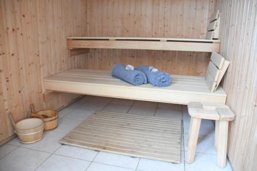 a bunk bed with two blue towels and a stool at Magda Hotel Club in Gouves