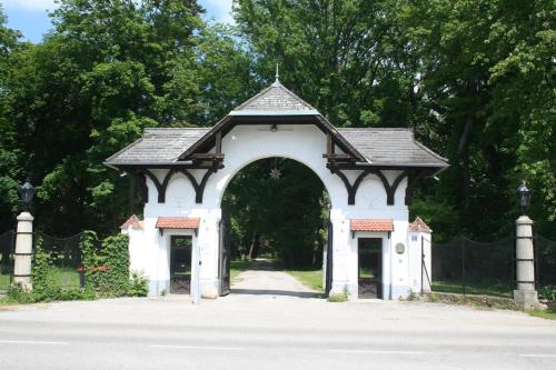 an archway in the middle of a road at Schloss Schönau in Schönau an der Triesting