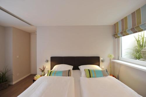 Ein Bett oder Betten in einem Zimmer der Unterkunft Ferien Domizil Erich-Johannsen-Wai 7