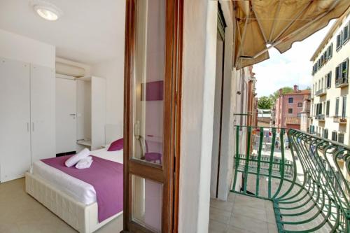 a bedroom with a bed on a balcony at Fenix La Bohéme in Venice