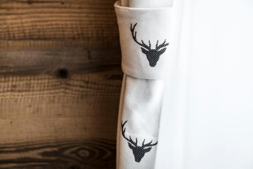a roll of toilet paper with deer heads on it at Alpine Chalet Sauter in San Vigilio Di Marebbe