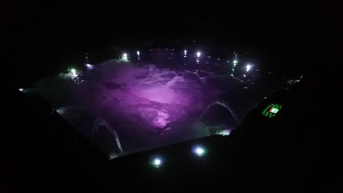 an aerial view of a city at night with lights at Les Bambous in Petite Île
