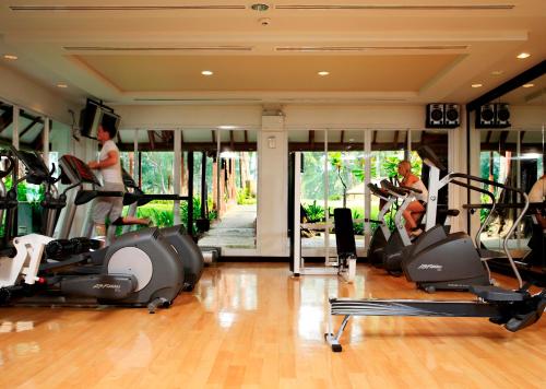 a gym with several people exercising on treadmills at Dusit Thani Laguna Phuket in Bang Tao Beach