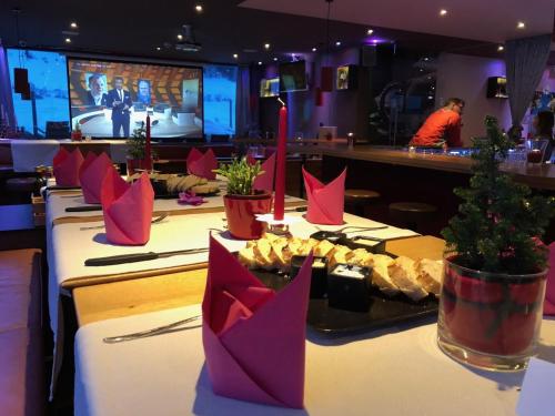 a table with christmas decorations on it in a restaurant at Ibex Hostel in Nauders